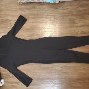 Puma black jumpsuit with black velvet paneling. Size small